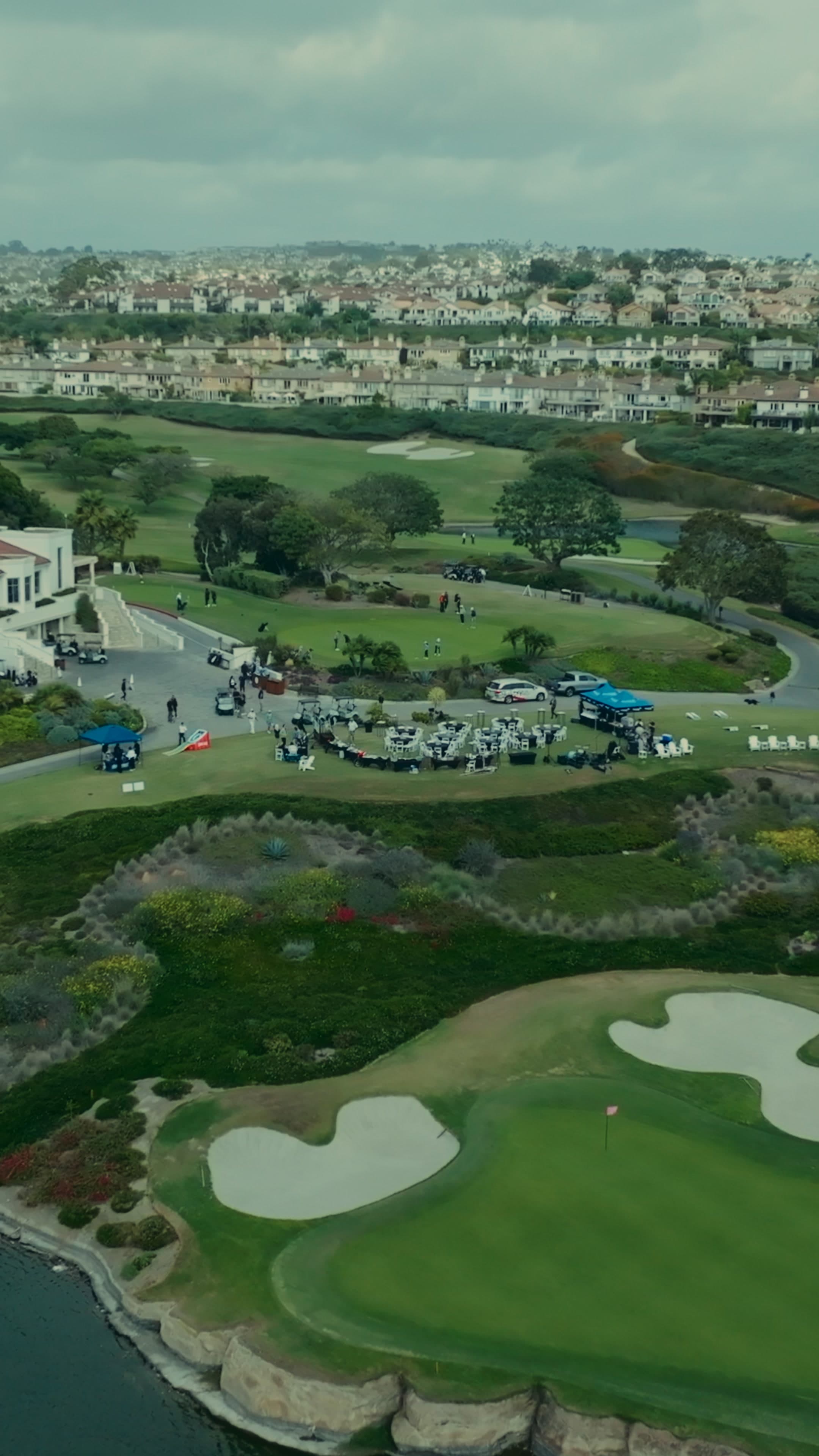 Aerial view of the One Water golf event on a coastal course